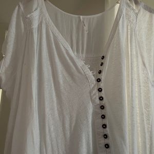 Free people white short sleeve top. Long length.